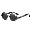 Nero Edge round steampunk metal sunglasses in jet black with double-blade accents and laser-cut detail